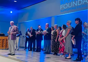 Award recipients standing on stage during a Masterwork ceremony